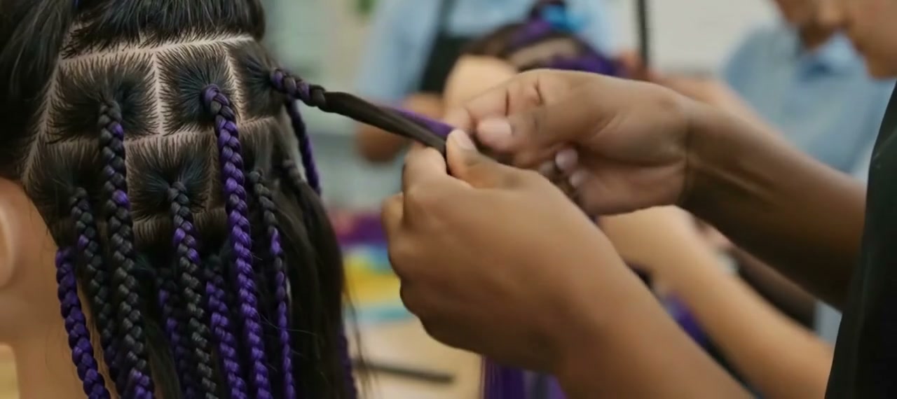 BeyondBraidz hair-braiding session